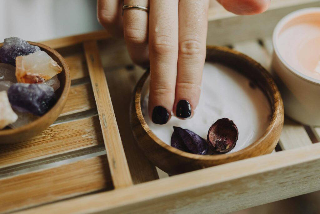 Indulge in a luxurious spa day with floral-infused hand treatments and natural crystals.